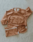 Micasso & Co Bavette à manches longues 6-24 mois avec pochette intégrée qui attrape la nourriture 6-24 mois Alimentation Micasso & Co Terracotta