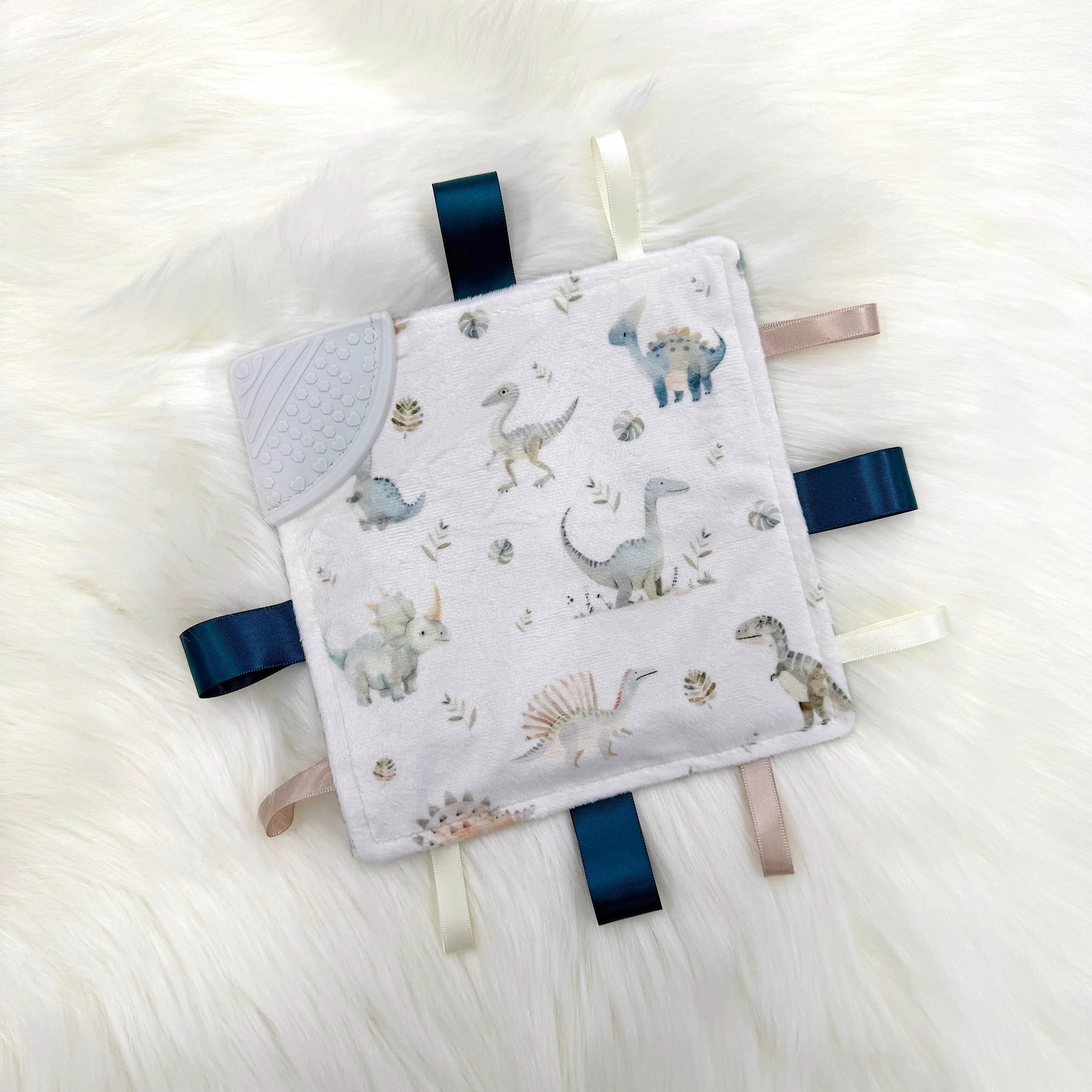 OleOops Doudou craquante à étiquettes Jouets OleOops Histoire de dinosaures